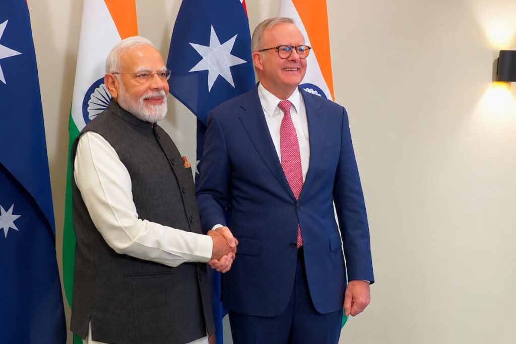 australia-india uranium deal - both countries PM shaking hands